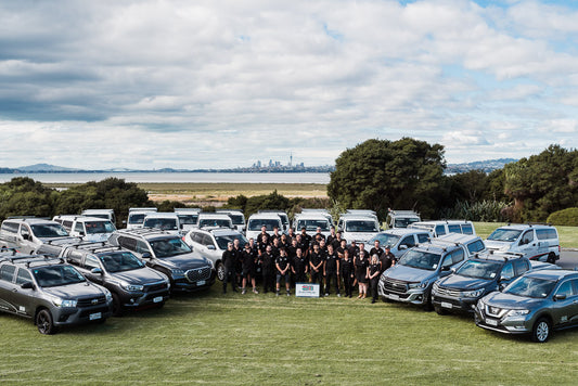 A massive group photo of branded vehicles for an electrical company