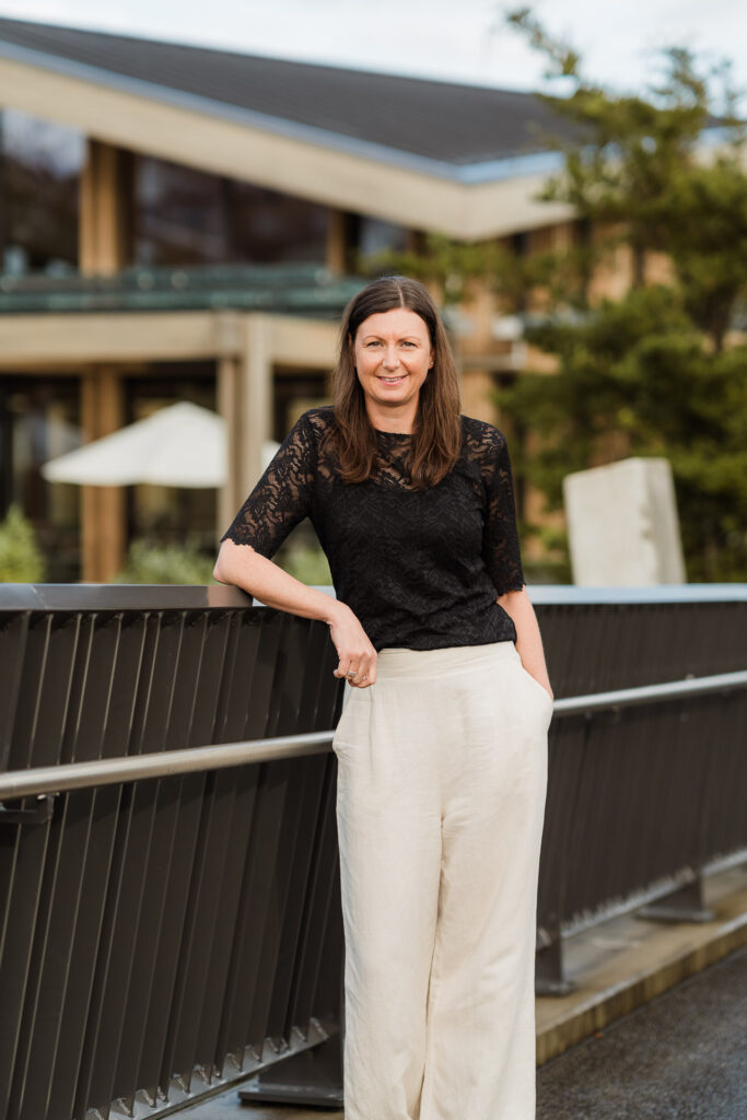 Individual modern headshot of a Martin & Parker Law team member shot in natural light at a Silverdale cafe by Wonderferris.