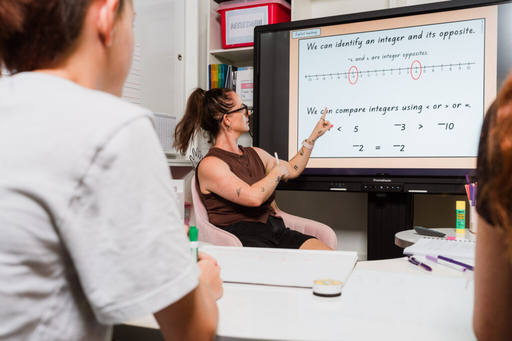 Wide shot showing kids using Mrs Priestly’s ICT products in a workspace environment, photographed by Wonderferris.