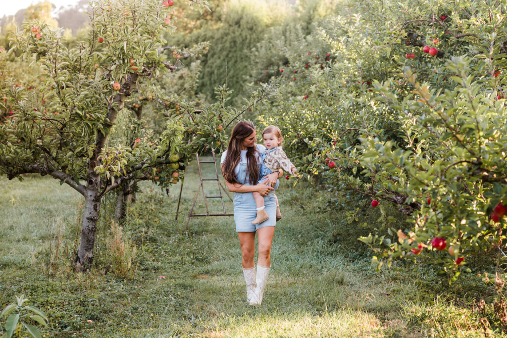 Natural family portrait taken at golden hour in a lush orchard, Auckland mini shoot by Wonderferris.