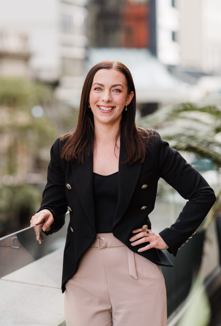 Professional headshot of a Co Legal team member taken on a rooftop in Auckland CBD by Wonderferris.