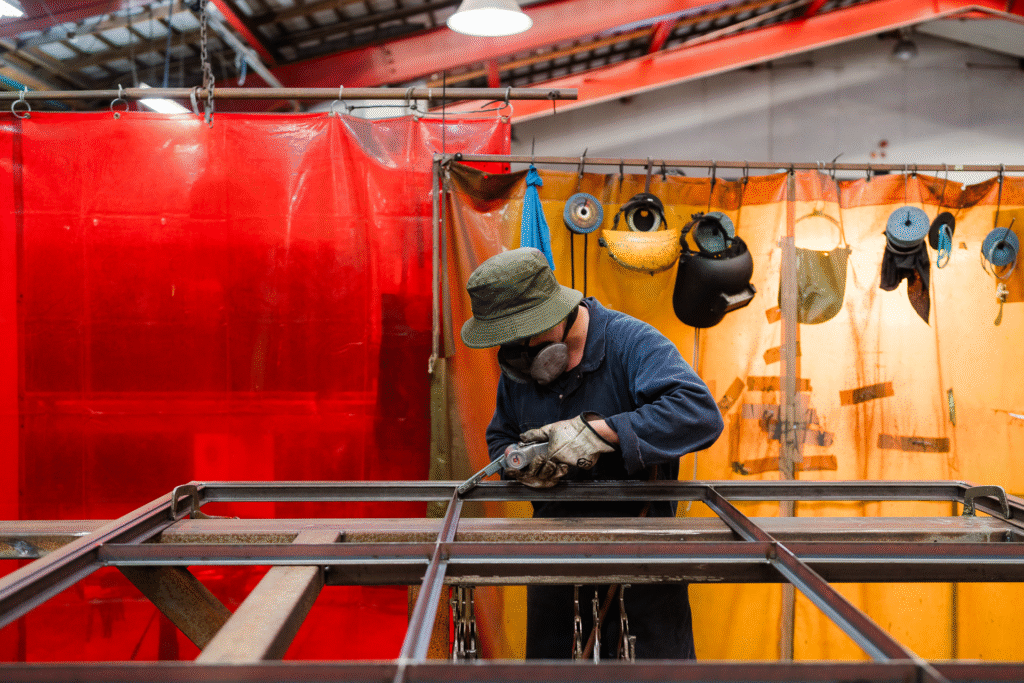 Clean brand photography of a Crittall team member working in the factory