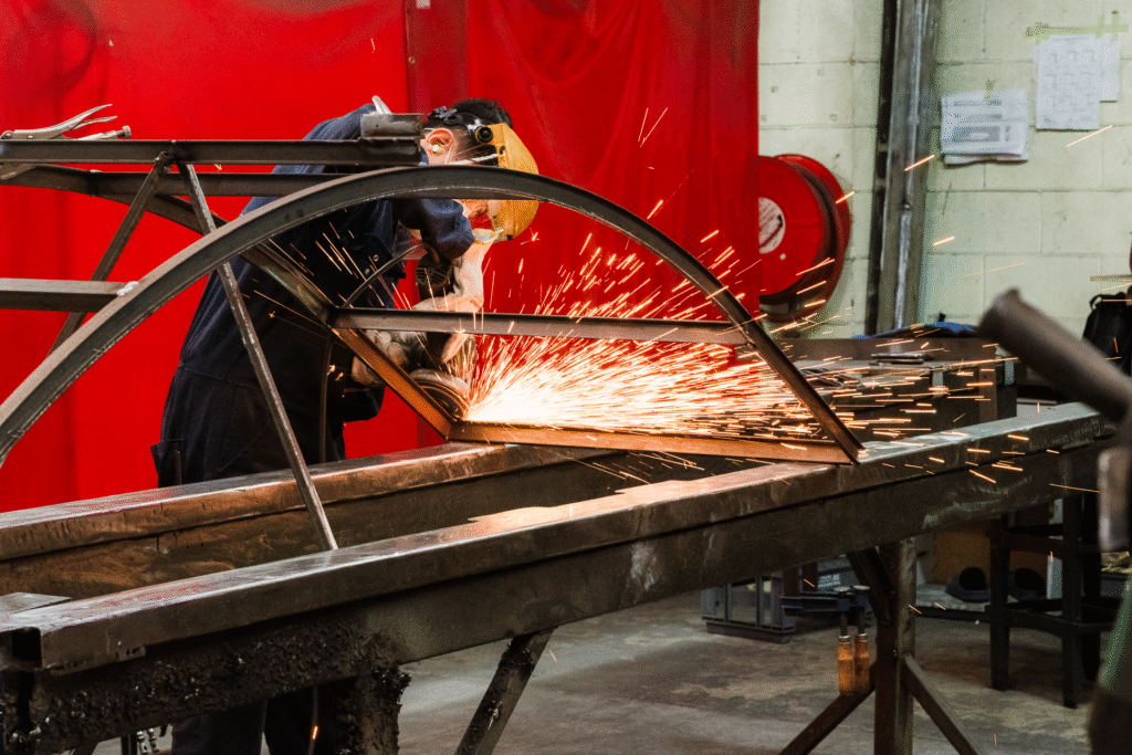 Staff member welding in the Crittall steel workshop, captured for Auckland content photography by Wonderferris.