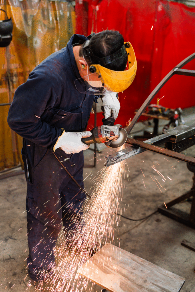 Staff member welding in the Crittall steel workshop, captured for Auckland content photography by Wonderferris photography.