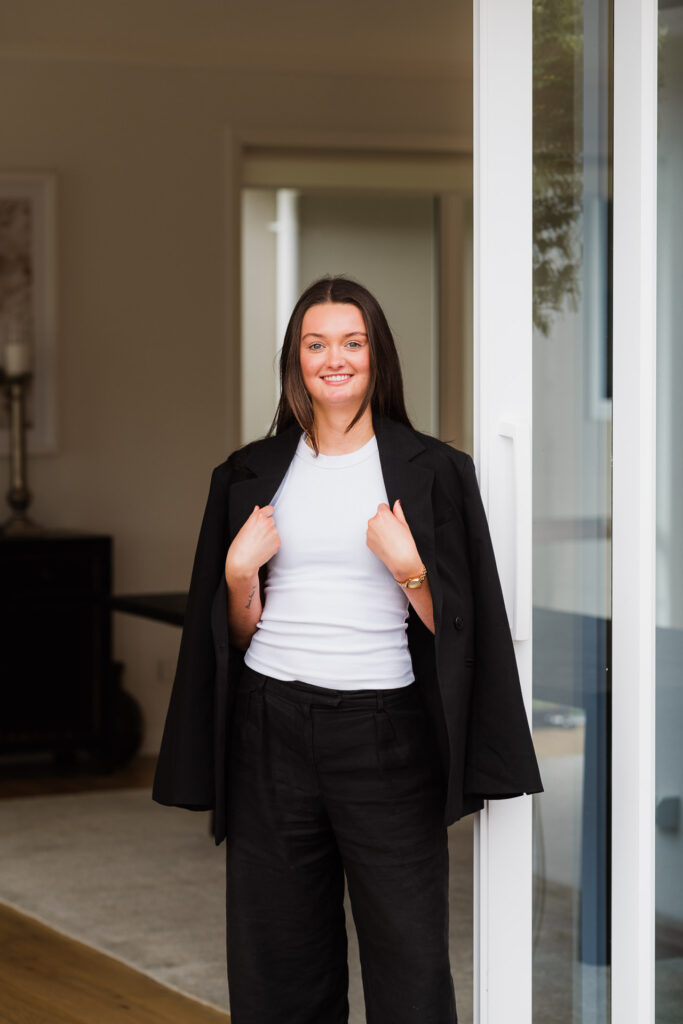 Crisp natural light portrait of a Make It Happen staff member, showcasing confidence and professionalism.
