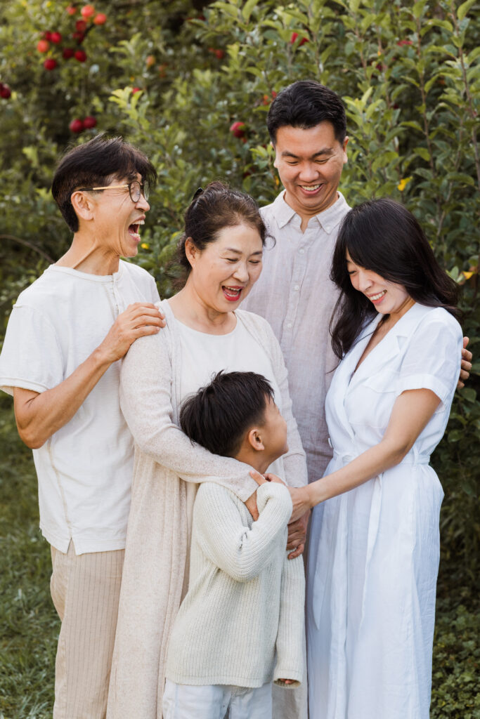 Wonderferris seasonal mini session photo showing authentic family connection in Auckland orchard.