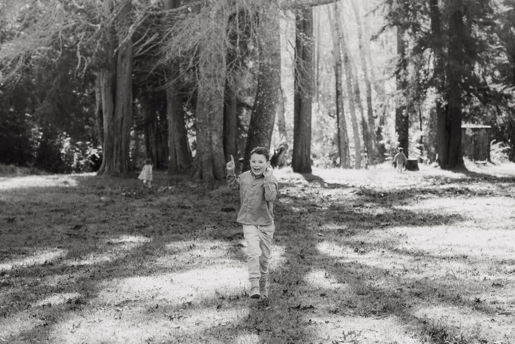 Natural portrait of a child in the forest with dappled sunlight — captured by Wonderferris